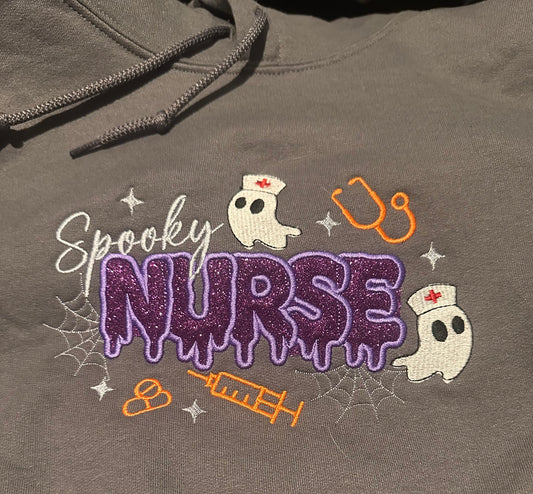 Spooky Nurse Appliqué Hoodie on Charcoal Grey Sweatshirt