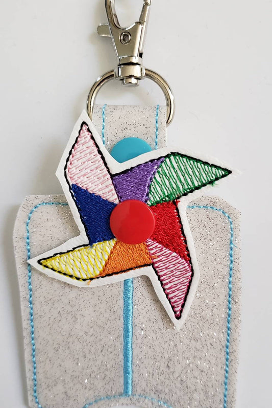 Hand sanitizer holder - glitter vinyl Pinwheel hand sanitizer holder - purse tag - sports bag tag - hand sanitizer fob - back pack tag